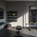 Sleek modern garage gym with black equipment, rubber flooring, wall storage, mirror, and an open workout area